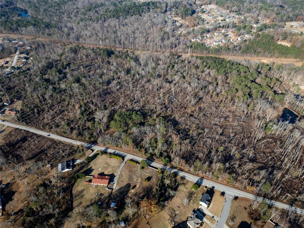 925 McDaniel Mill Road Southwest Conyers, GA 30094 - Photo 2 of 15 a view of a city with lush green forest