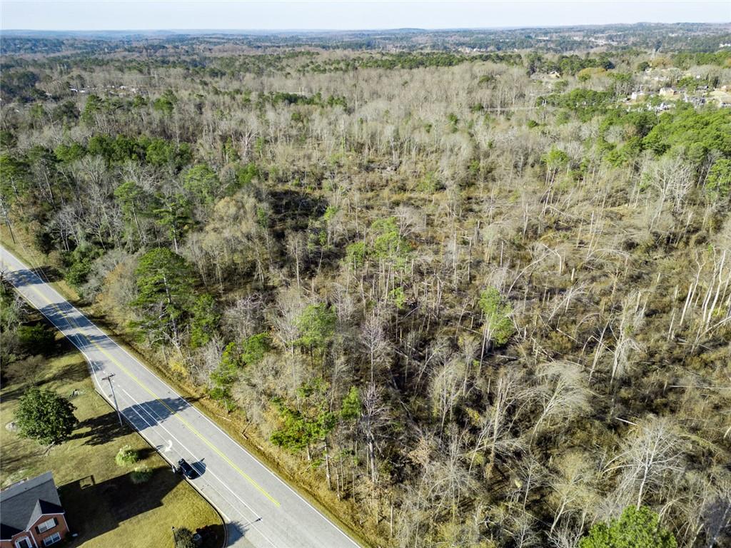 925 McDaniel Mill Road Southwest Conyers, GA 30094 - Photo 8 of 15 an aerial view of house with yard