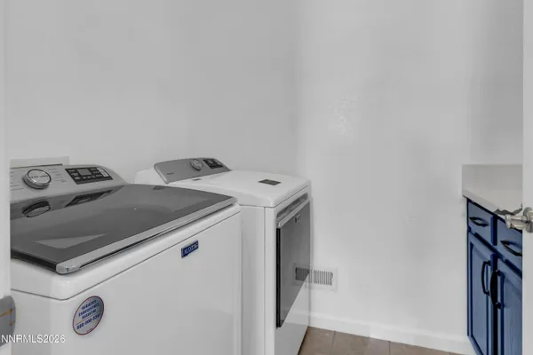 a bed room with furniture and a wooden floor