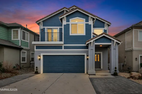 a front view of a house with a garage