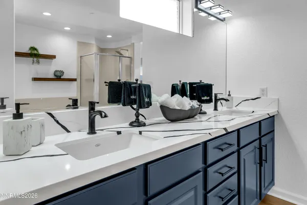 a living room with furniture a flat screen tv and a large window