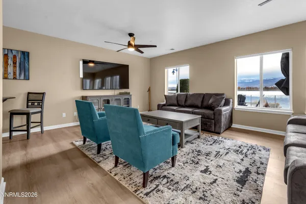 a view of an entryway with wooden floor and stairs