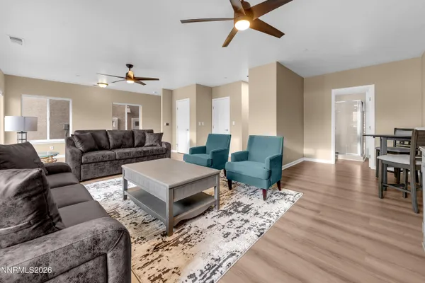 a bedroom with a bed a mirror and a window