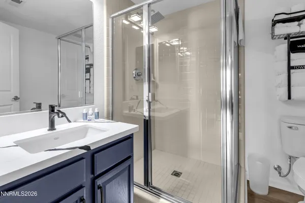 a view of a hallway with furniture and a living room