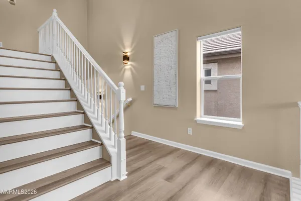 a front view of a house with lake view and mountain view