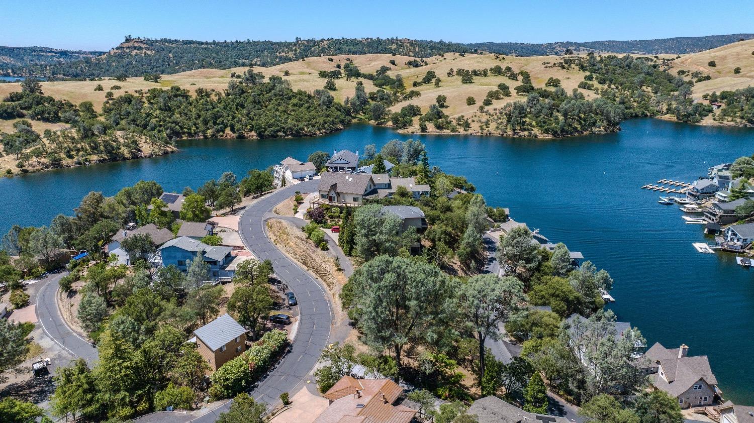 215 Oakhurst Court Copperopolis, CA 95228 - Photo 1 of 16 an aerial view of a houses with a lake view