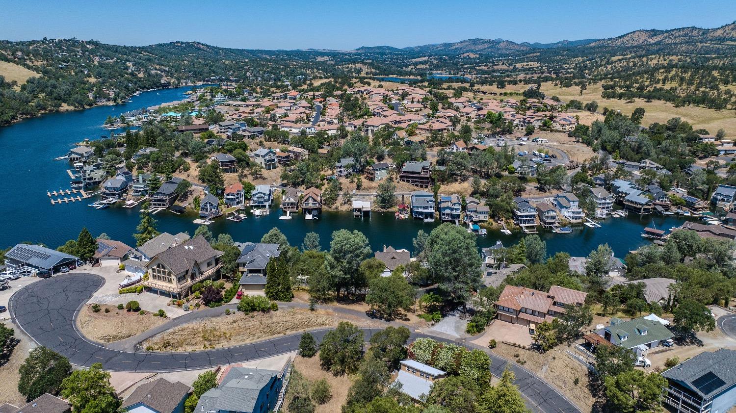 215 Oakhurst Court Copperopolis, CA 95228 - Photo 13 of 16 a view of a city with a lake