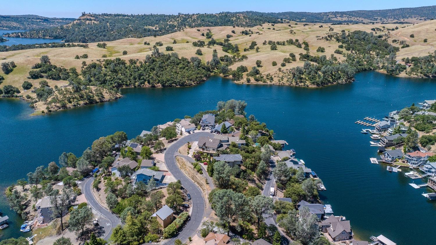 215 Oakhurst Court Copperopolis, CA 95228 - Photo 15 of 16 a view of a lake with a mountain in the background