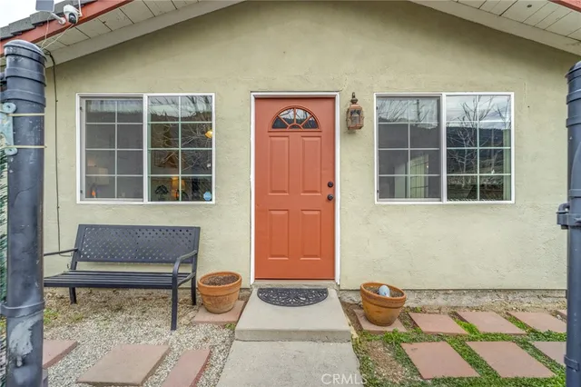 a front view of a house with outdoor space