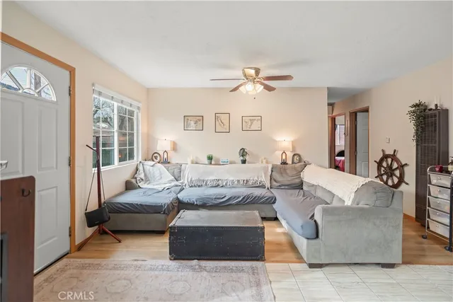a living room with furniture and a large window