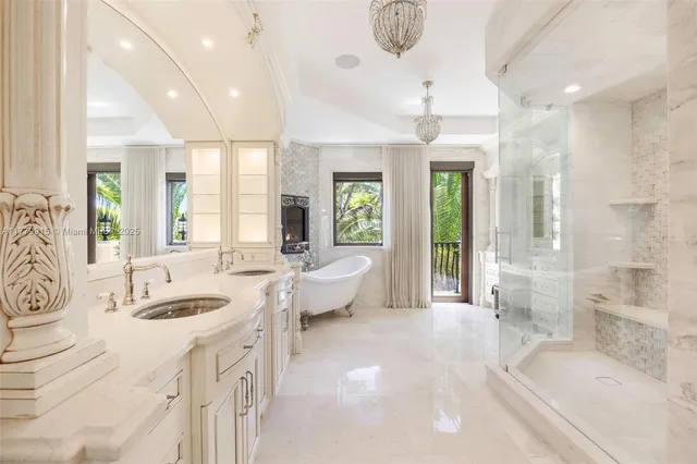 a spacious bathroom with a granite countertop tub sink and mirror