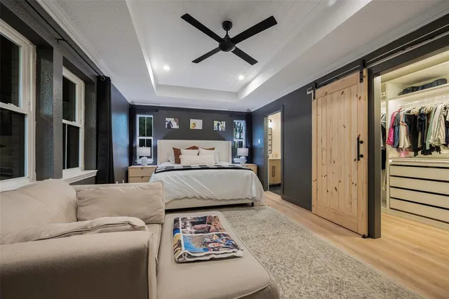 a view of a dining room with furniture and a chandelier