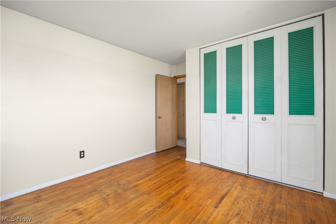 5697 Jaycox Road North Ridgeville, OH 44039 - Photo 11 of 28 bedroom with a closet and hardwood flooring