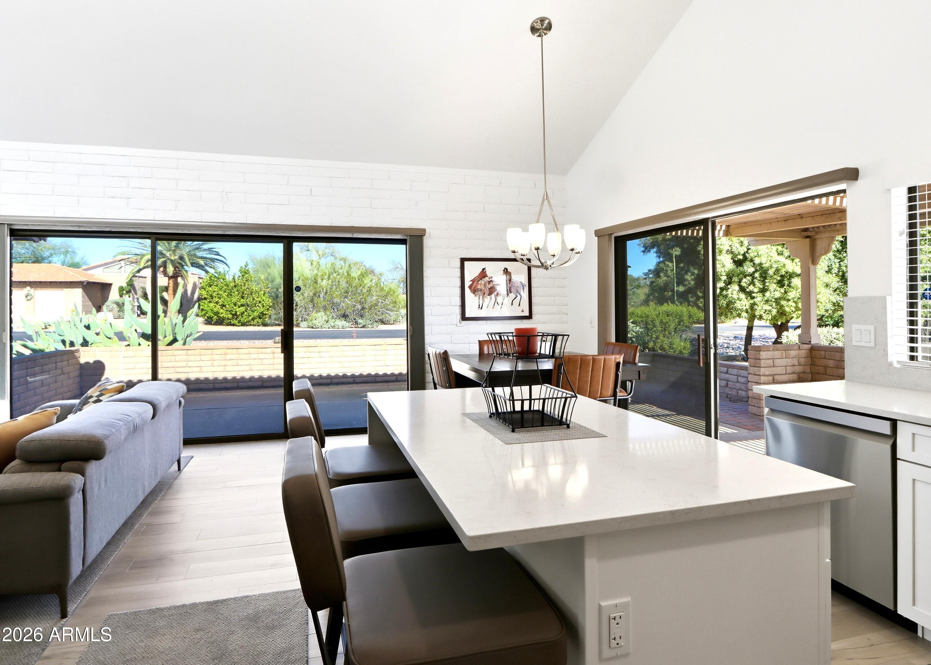 18814 East Loredo Lane Rio Verde, AZ 85263 - Photo 13 of 34 a view of a dining room with furniture window and outside view