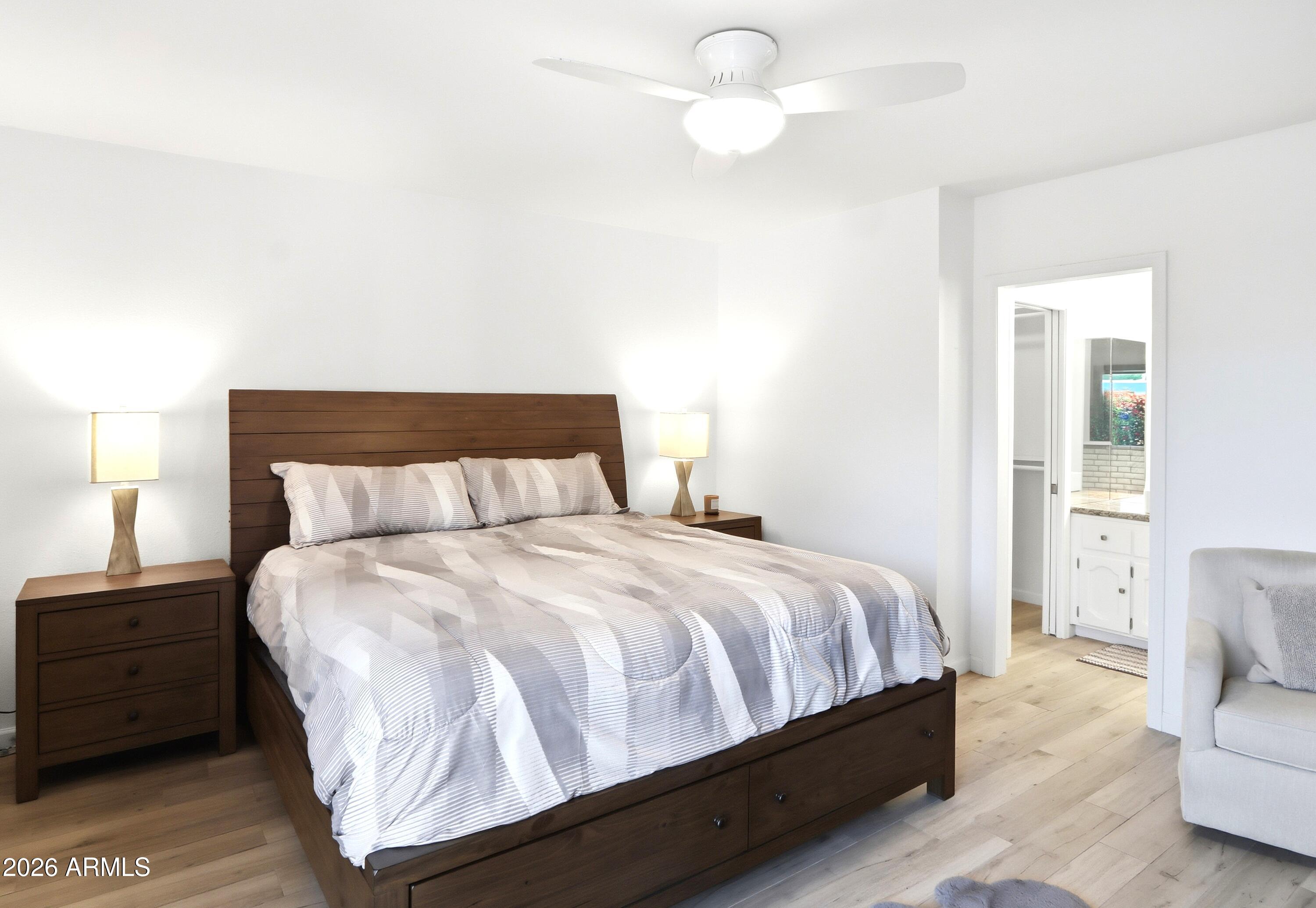 18814 East Loredo Lane Rio Verde, AZ 85263 - Photo 18 of 34 a bedroom with a bed and a couch