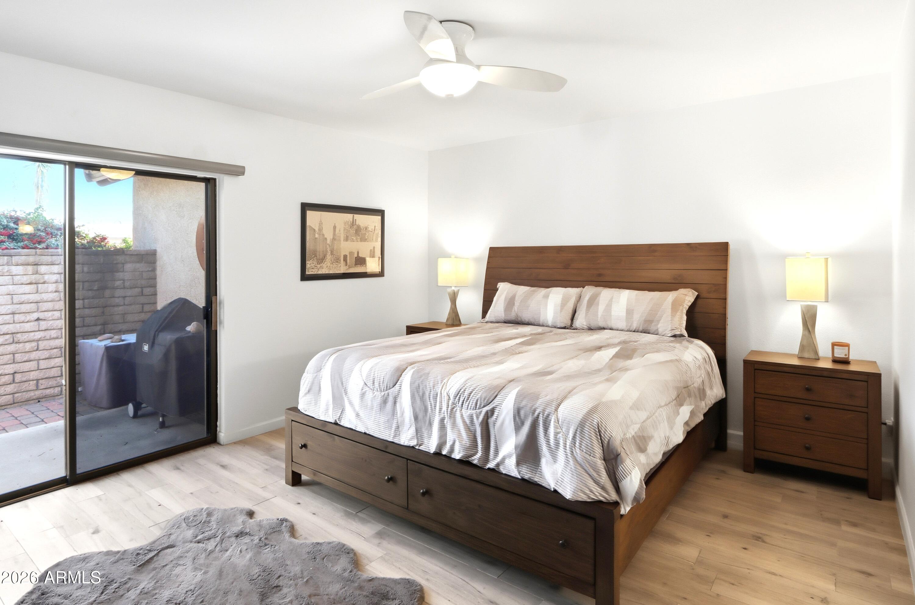 18814 East Loredo Lane Rio Verde, AZ 85263 - Photo 19 of 34 a bedroom with a bed and a lamp