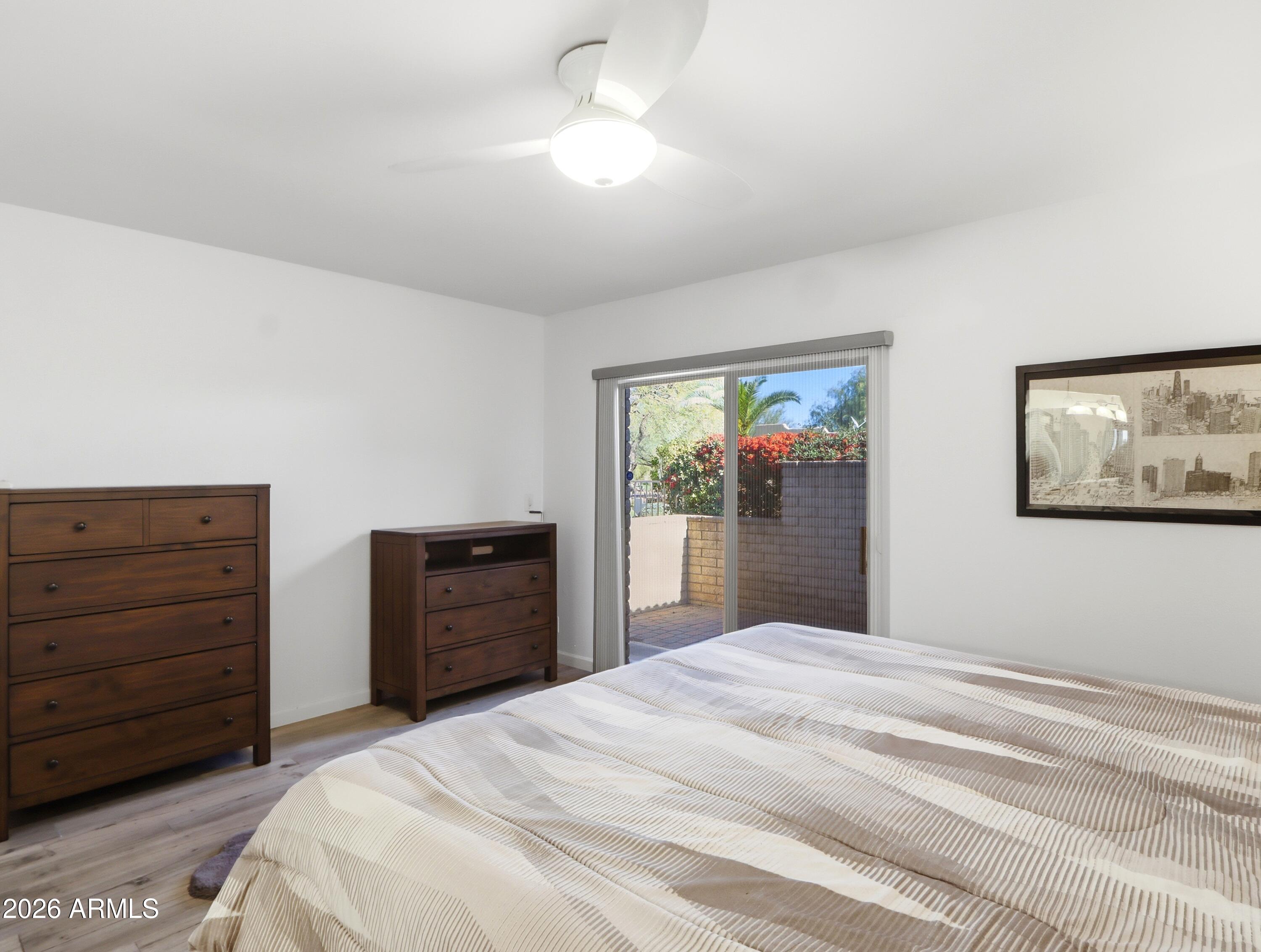 18814 East Loredo Lane Rio Verde, AZ 85263 - Photo 20 of 34 a bedroom with a bed and a dresser