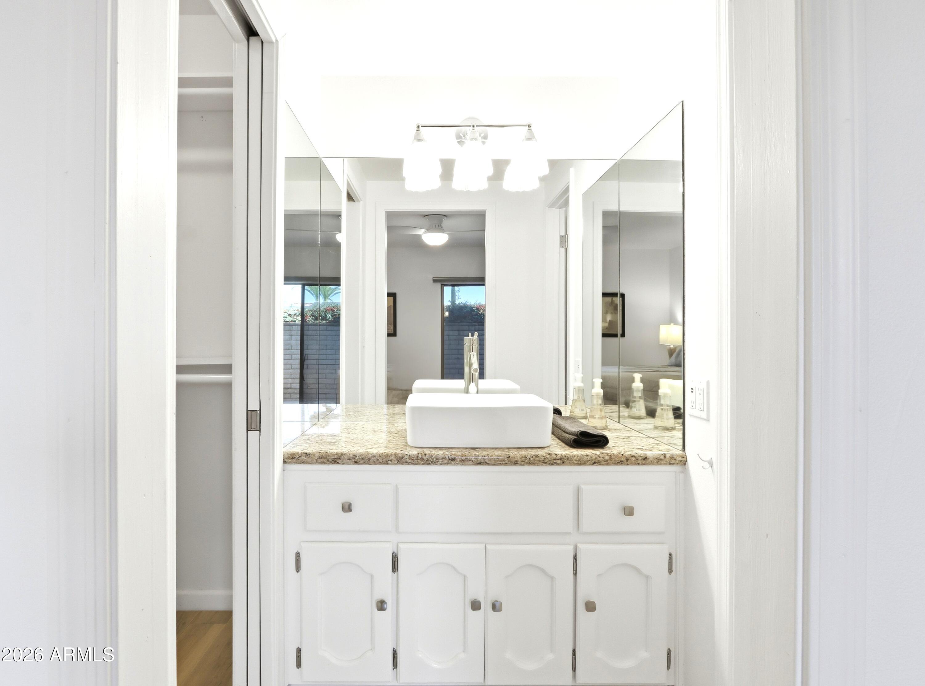 18814 East Loredo Lane Rio Verde, AZ 85263 - Photo 22 of 34 a bathroom with a sink and a mirror