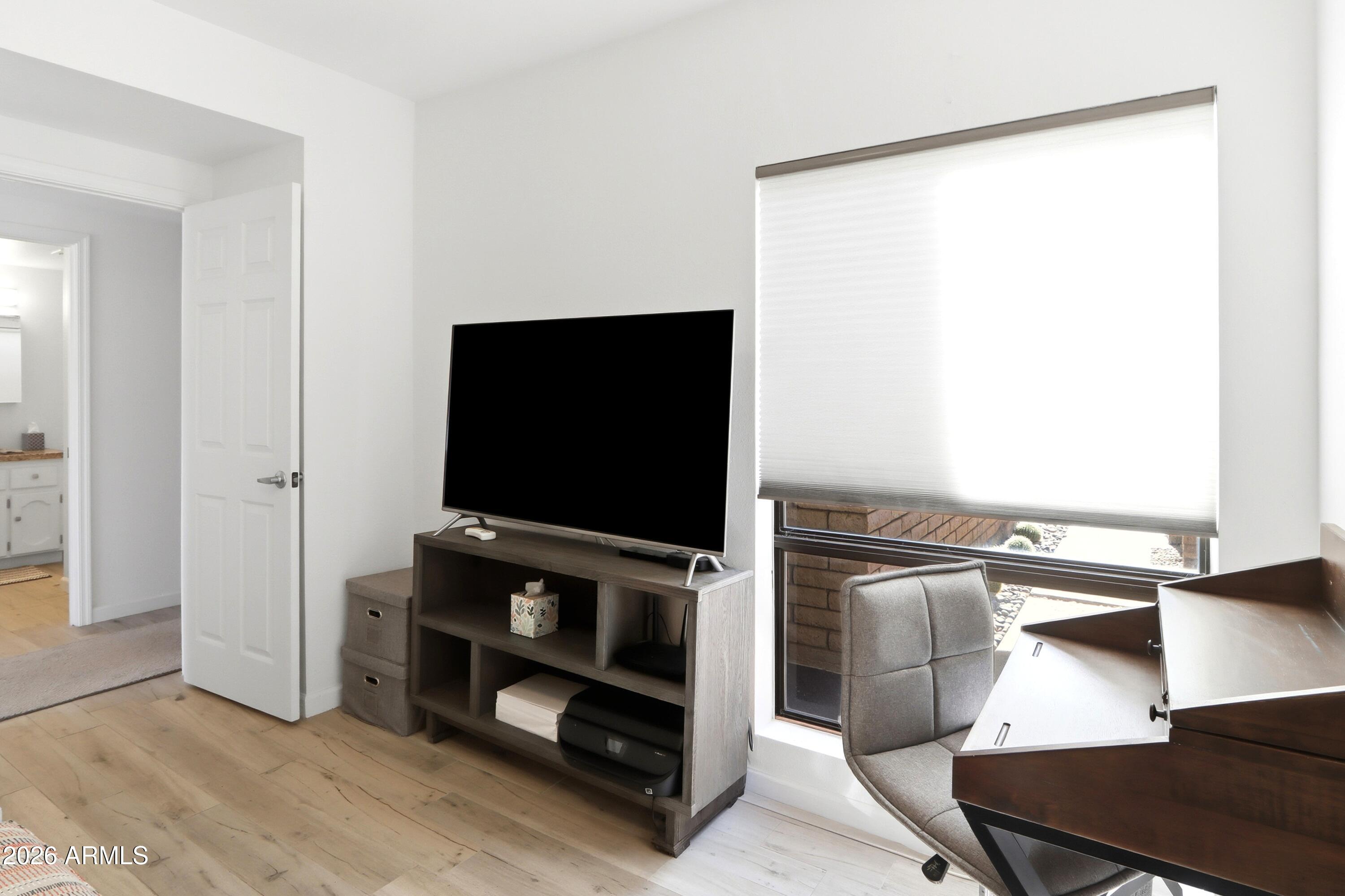 18814 East Loredo Lane Rio Verde, AZ 85263 - Photo 26 of 34 a living room with flat screen tv and furniture