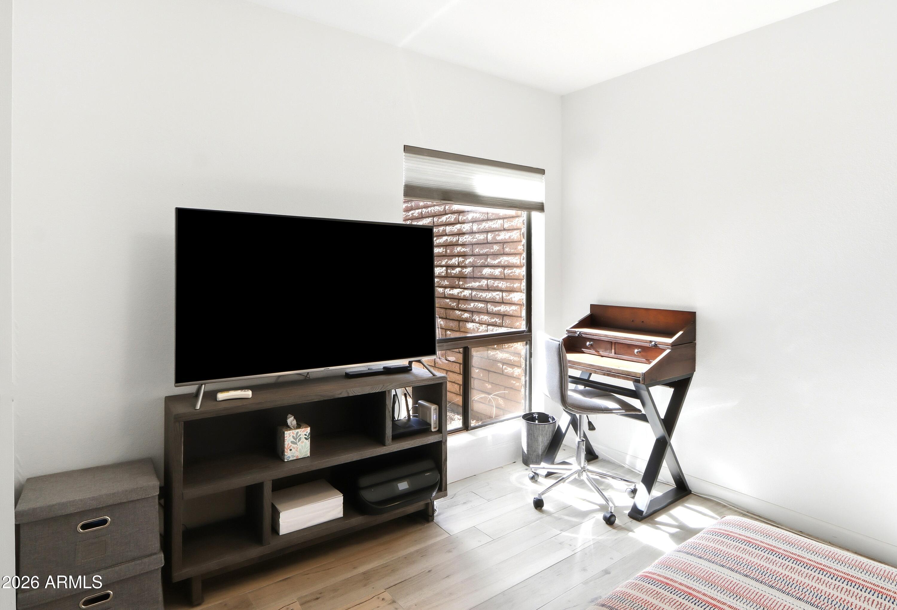 18814 East Loredo Lane Rio Verde, AZ 85263 - Photo 27 of 34 a room with furniture and a flat screen tv