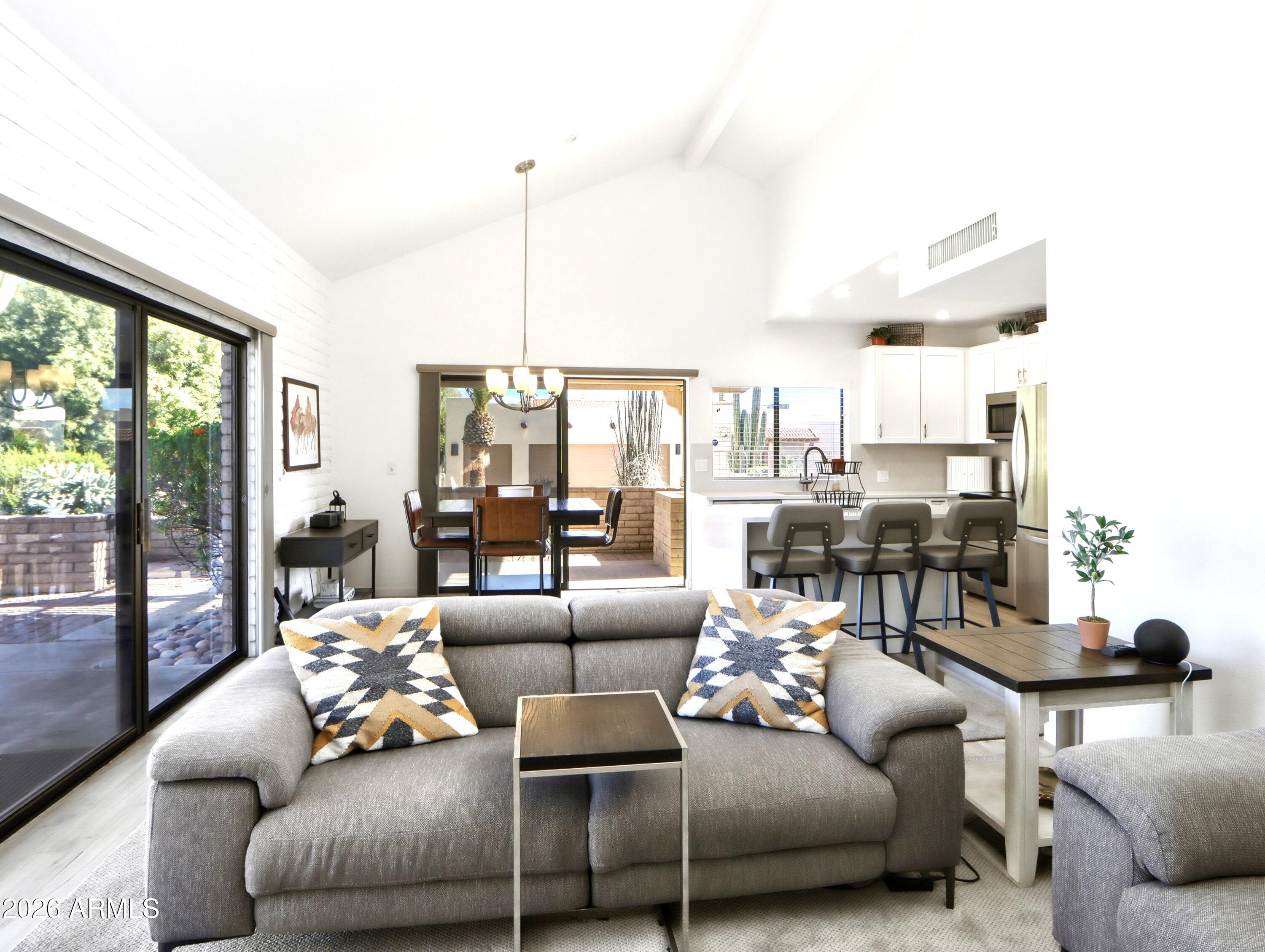 18814 East Loredo Lane Rio Verde, AZ 85263 - Photo 5 of 34 a living room with furniture and large windows