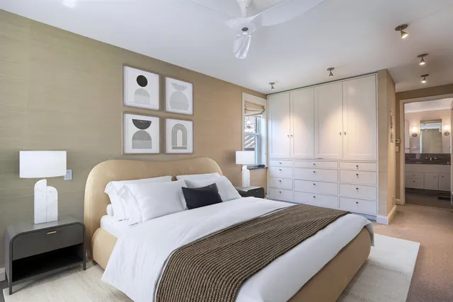 a bedroom with a large bed and a closet