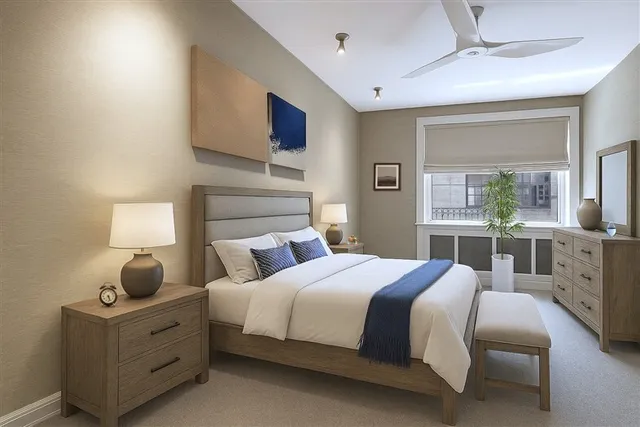 a bedroom with a bed and a couch