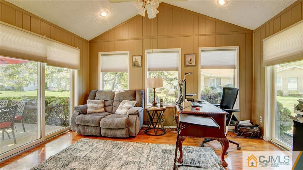 801 A Pompton Road, Unit 801A Monroe Township, NJ 08831 - Photo 15 of 33 a living room with furniture and a floor to ceiling window