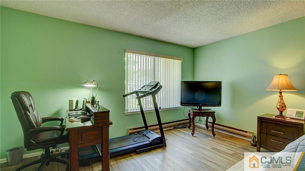 801 A Pompton Road, Unit 801A Monroe Township, NJ 08831 - Photo 18 of 33 a view of a workspace with furniture and a window