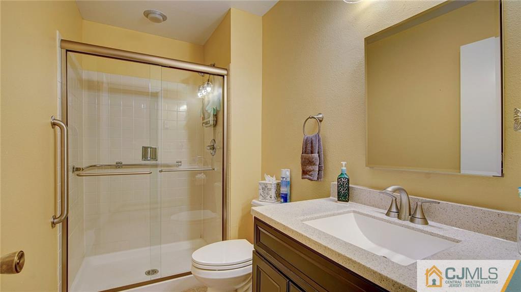 801 A Pompton Road, Unit 801A Monroe Township, NJ 08831 - Photo 19 of 33 a bathroom with a sink toilet and shower