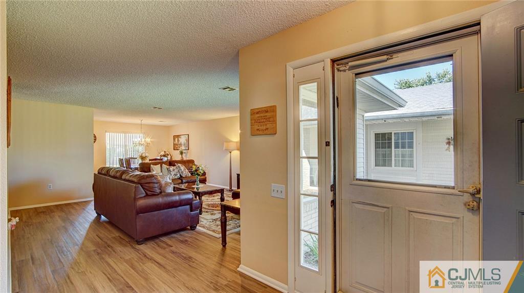 801 A Pompton Road, Unit 801A Monroe Township, NJ 08831 - Photo 3 of 33 a living room with furniture and a window