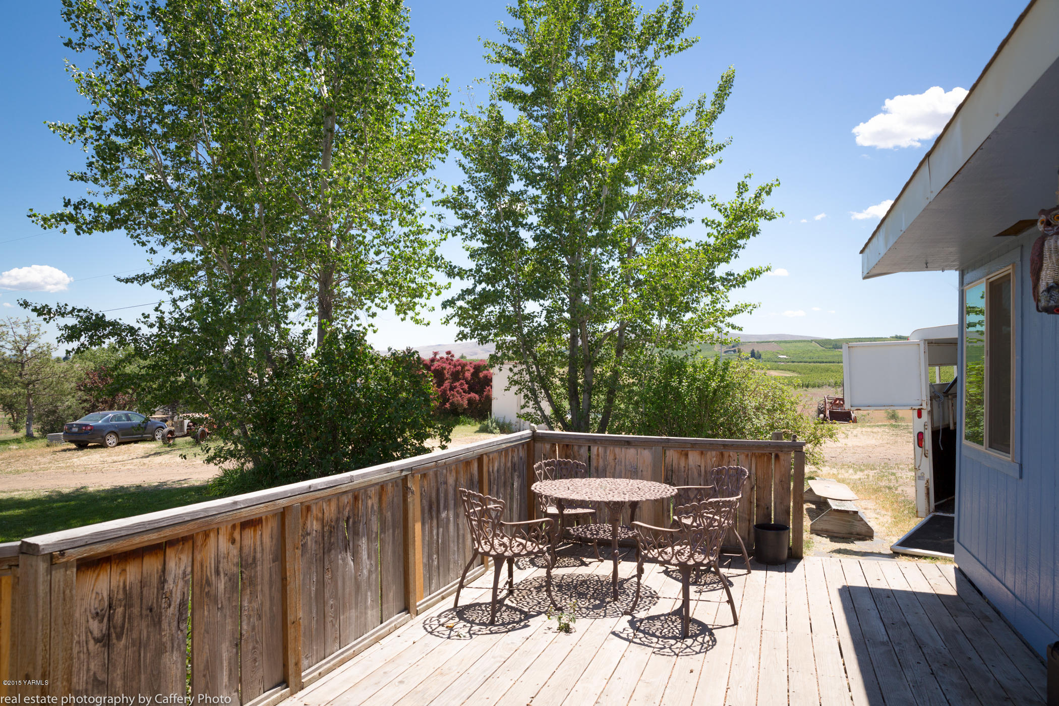 252-250 Knutson Road Tieton, WA 98947 - Photo 18 of 51 a balcony with wooden floor and outdoor seating