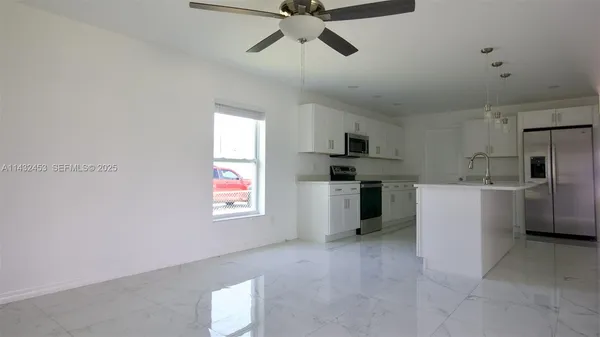 a view of a room with a fan