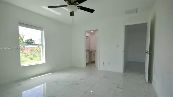 a view of an empty room with a window