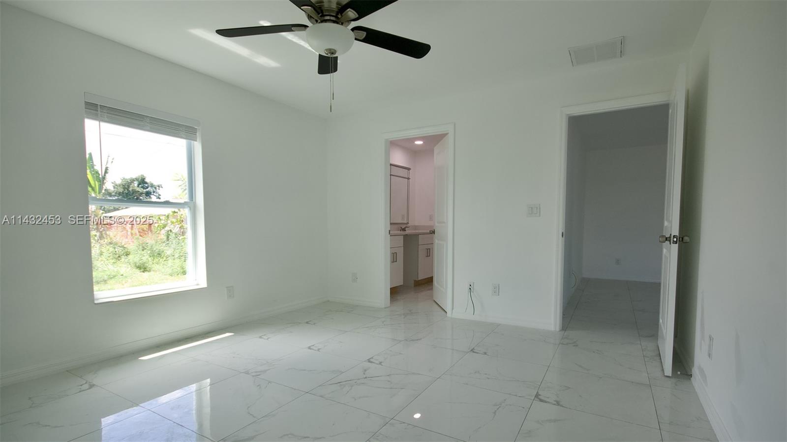 3433 Jeffcott Street Fort Myers, FL 33916 - Photo 20 of 41 a view of an empty room with a window