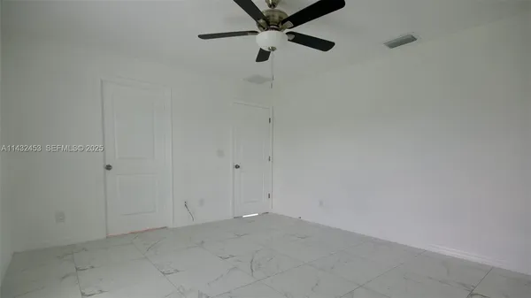 a bathroom with a double vanity sink and mirror