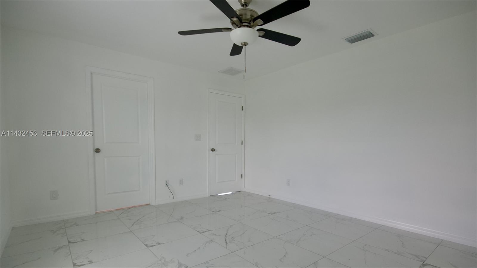 3433 Jeffcott Street Fort Myers, FL 33916 - Photo 22 of 41 a view of a room with a fan
