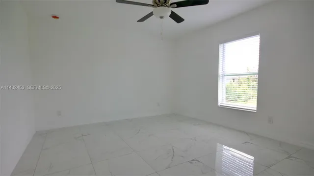 a bathroom with a granite countertop sink double and mirror