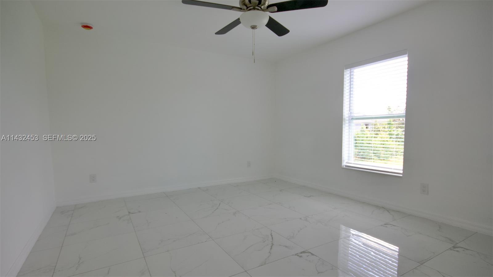 3433 Jeffcott Street Fort Myers, FL 33916 - Photo 23 of 41 a view of an empty room with a window