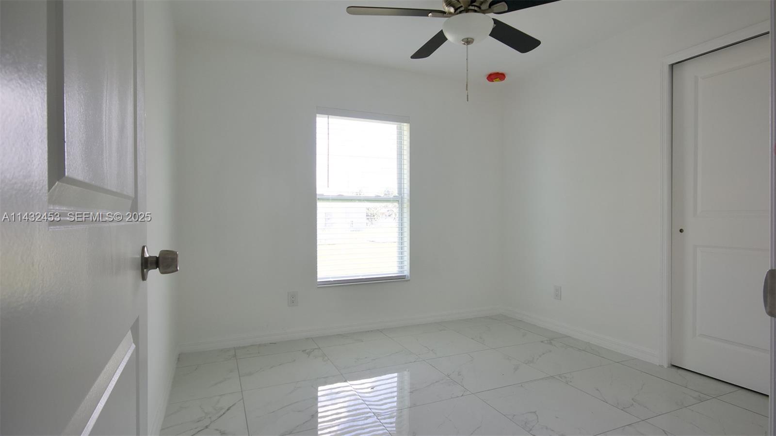 3433 Jeffcott Street Fort Myers, FL 33916 - Photo 33 of 41 a view of an empty room with a window