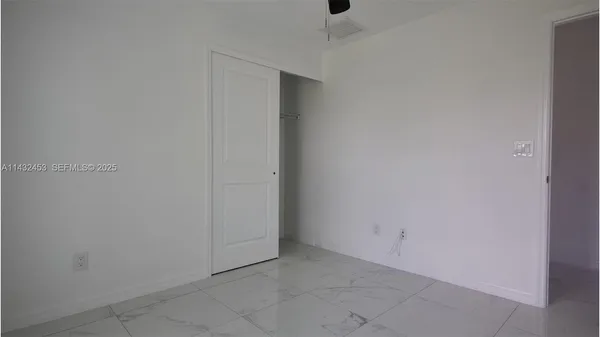 a bathroom with a double vanity sink toilet and shower