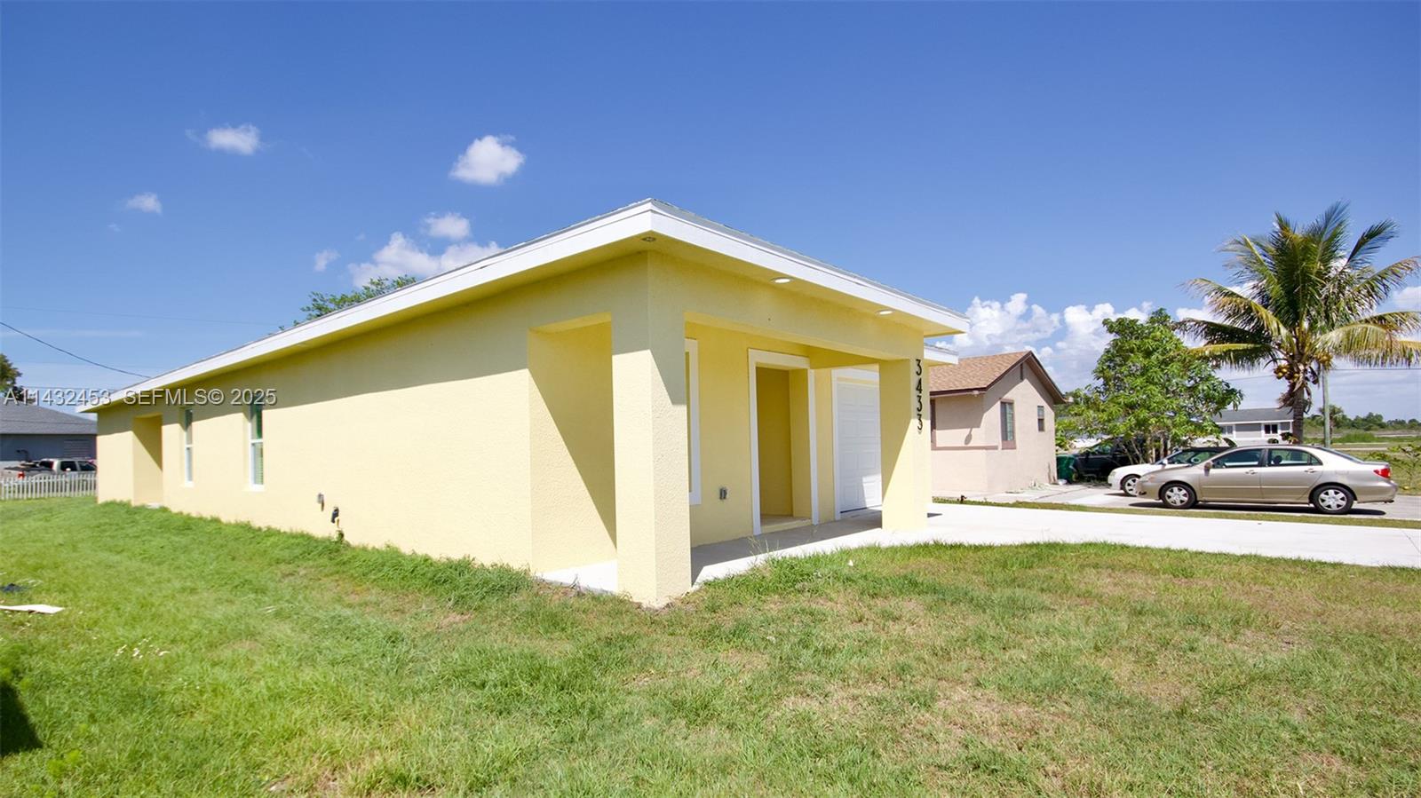 3433 Jeffcott Street Fort Myers, FL 33916 - Photo 8 of 41 a yellow house with trees in front of it