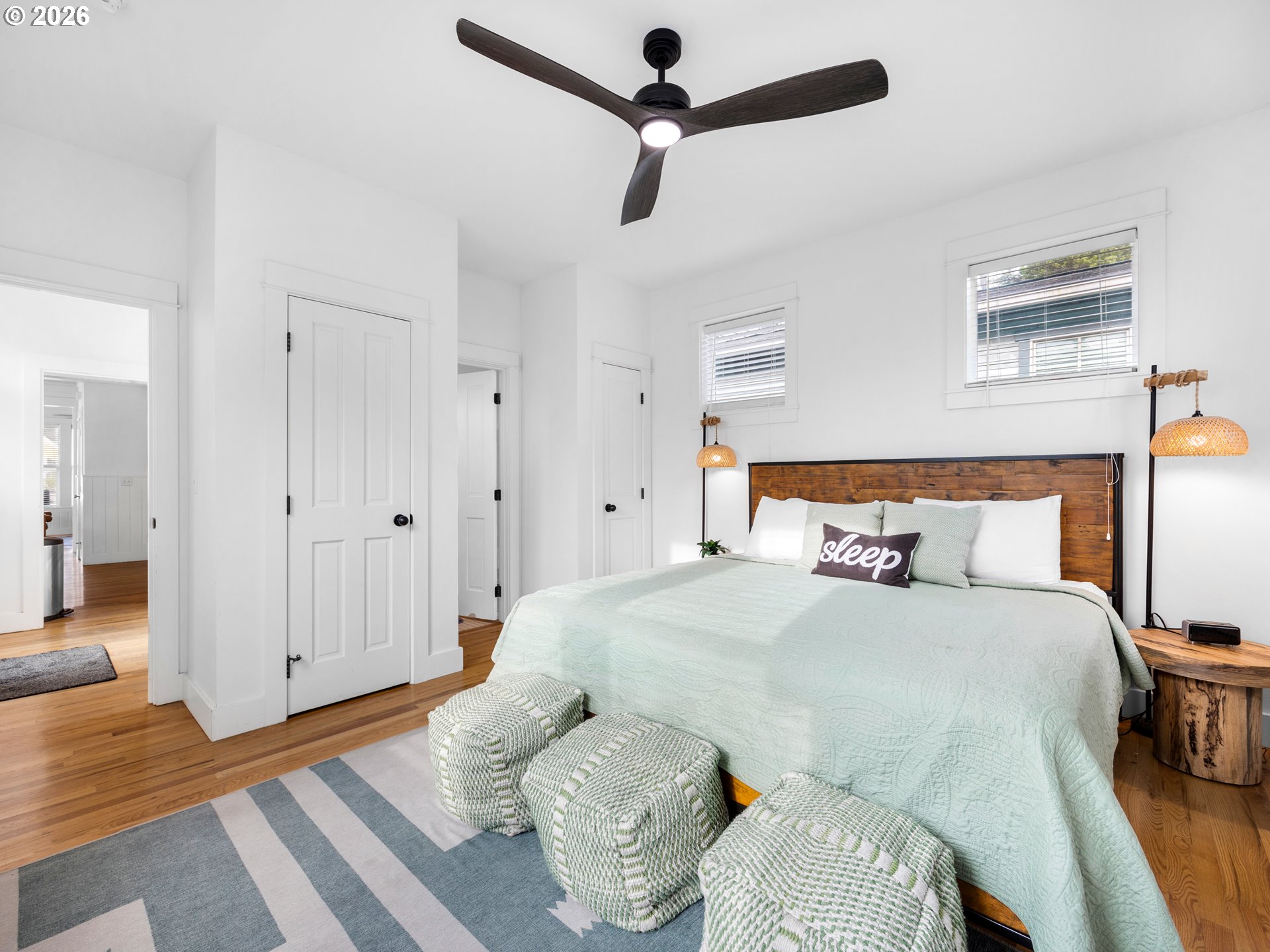 2746 Southwest Barnacle Avenue Lincoln City, OR 97367 - Photo 16 of 48 a bedroom with a bed and a chandelier