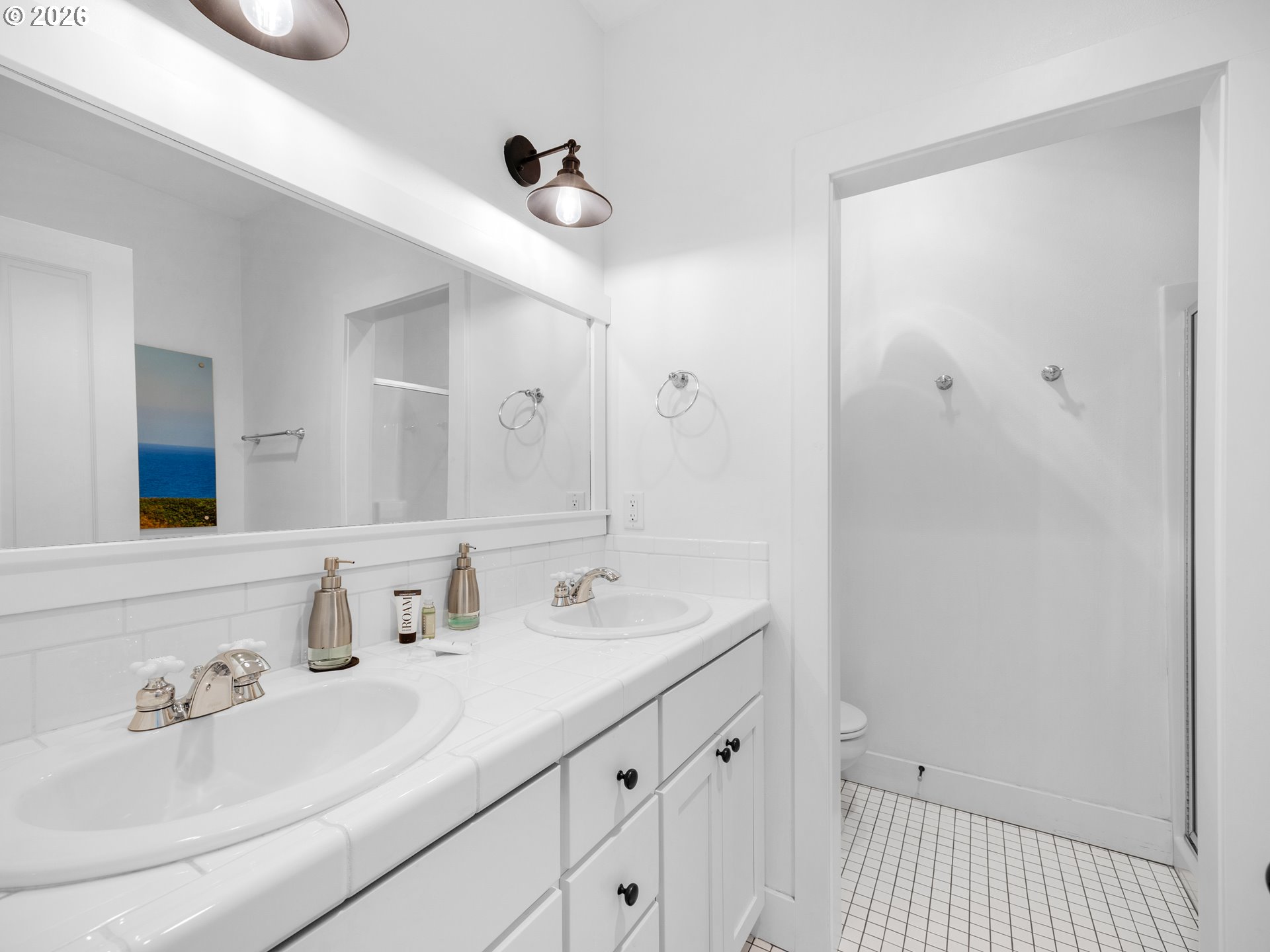 2746 Southwest Barnacle Avenue Lincoln City, OR 97367 - Photo 18 of 48 a bathroom with a sink and a mirror