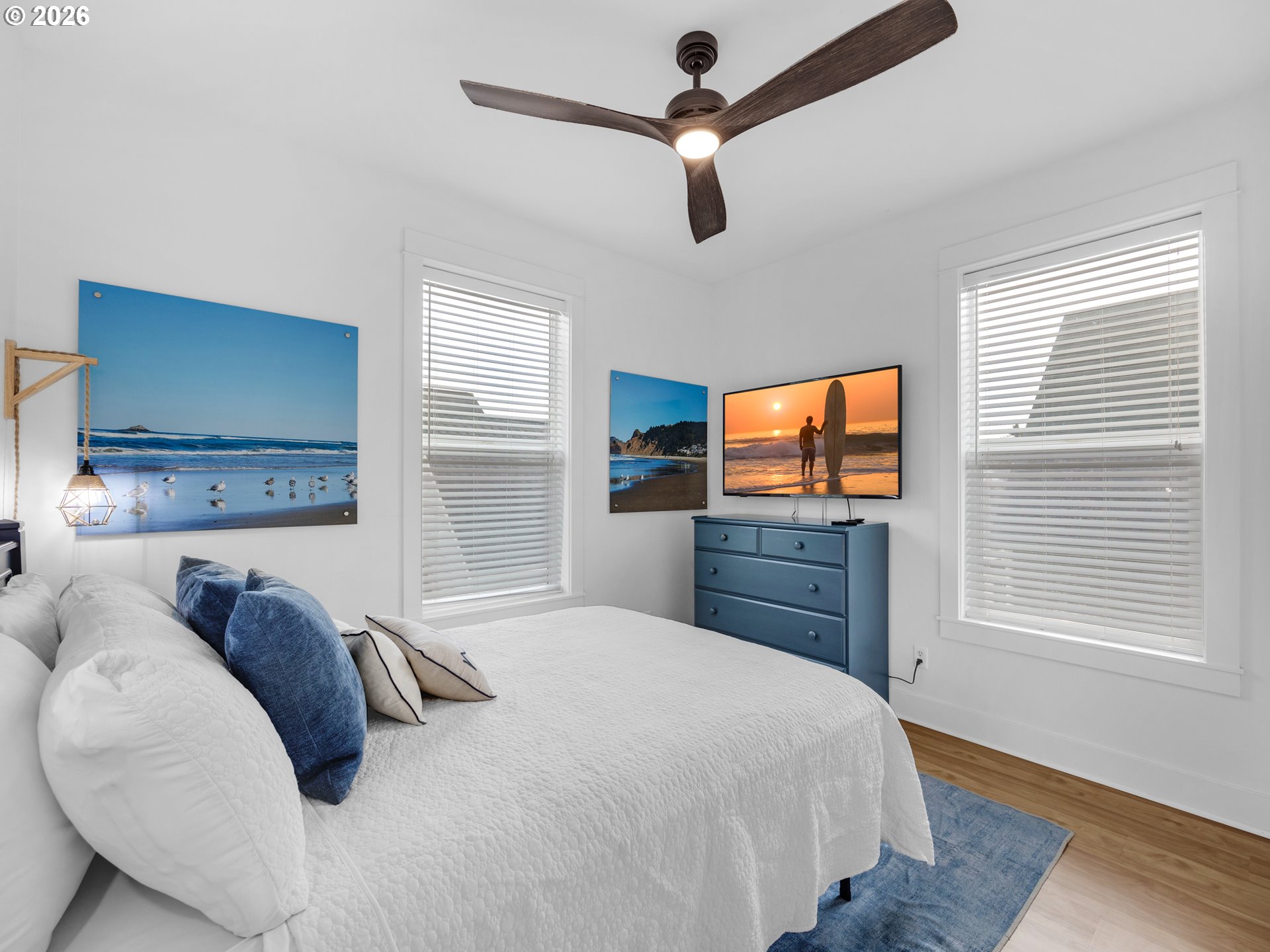 2746 Southwest Barnacle Avenue Lincoln City, OR 97367 - Photo 26 of 48 a bedroom with a bed and a flat screen tv