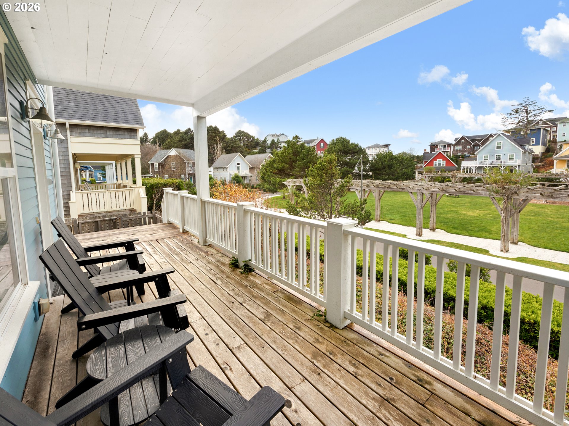 2746 Southwest Barnacle Avenue Lincoln City, OR 97367 - Photo 32 of 48 a view of a balcony with wooden chairs
