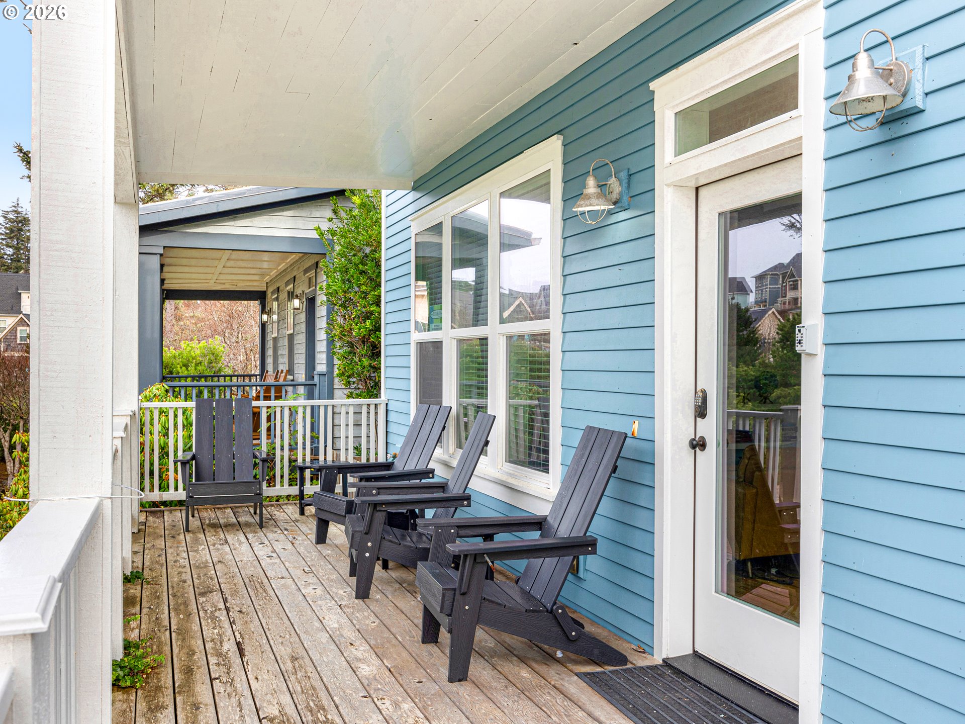 2746 Southwest Barnacle Avenue Lincoln City, OR 97367 - Photo 36 of 48 a balcony with wooden floor and furniture
