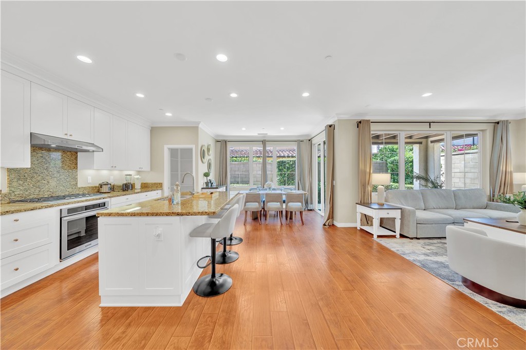 75 Gardenstone Path Irvine, CA 92620 - Photo 10 of 65 a large living room with stainless steel appliances granite countertop a couch and a view of living room