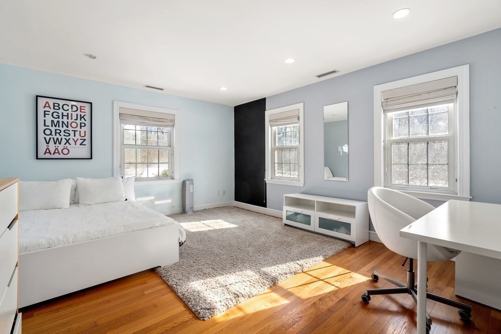 448 Quinobequin Road Newton, MA 02468 - Photo 19 of 35 a living room with furniture and a window