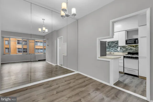 a white stove top oven sitting inside of a kitchen